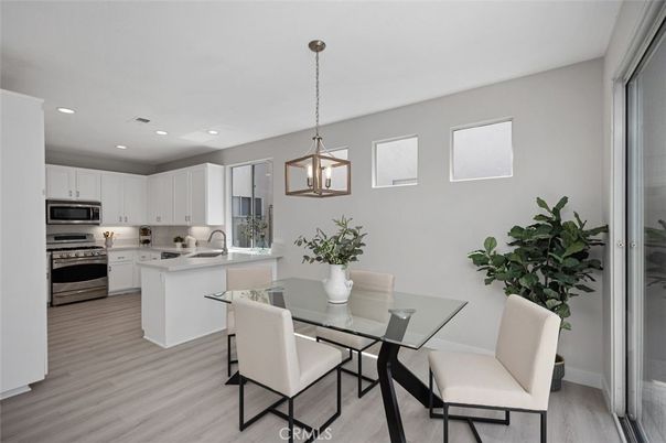 Dining room, Interior, Kitchen, Pendant Lights, Recessed Lighting, Stainless Steel Appliances, Wood Texture Flooring