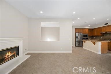 Empty room, Fireplace, Interior, Kitchen, Recessed Lighting, Stainless Steel Appliances