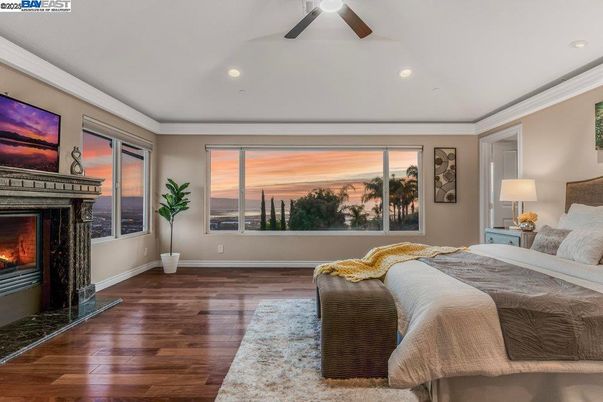 Bedroom, Fireplace, Interior, Recessed Lighting, Water, Wood Texture Flooring