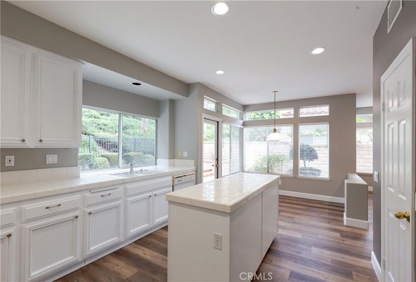 Interior, Kitchen, Pendant Lights, Recessed Lighting, Tile Countertops, Wood Texture Flooring