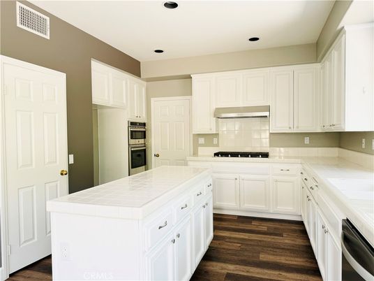 Interior, Kitchen, Recessed Lighting, Stainless Steel Appliances, Tile Countertops, Wood Texture Flooring