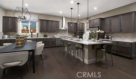 Chandelier, Dining room, Interior, Kitchen, Pendant Lights, Recessed Lighting, Stainless Steel Appliances, Wood Texture Flooring