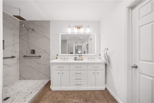 Bathroom, Dual Sink Vanities, Interior, Marble Walls, Wood Texture Flooring
