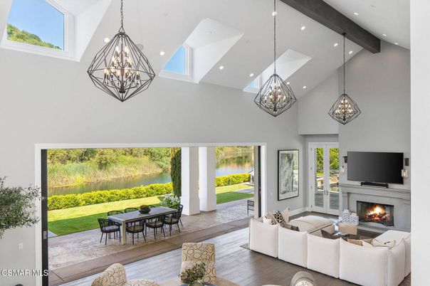 Chandelier, Fireplace, Interior, Living room, Pendant Lights, Recessed Lighting, Water, Wooden Beams, Wood Texture Flooring