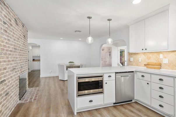 Interior, Kitchen, Pendant Lights, Recessed Lighting, Stainless Steel Appliances, Stone Walls, Wood Texture Flooring