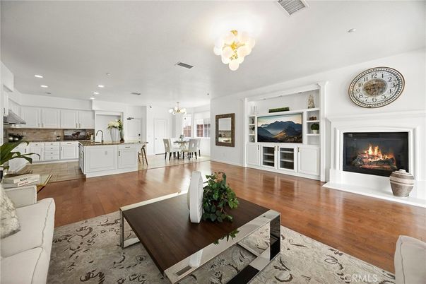 Chandelier, Dining room, Fireplace, Interior, Kitchen, Recessed Lighting, Wood Texture Flooring