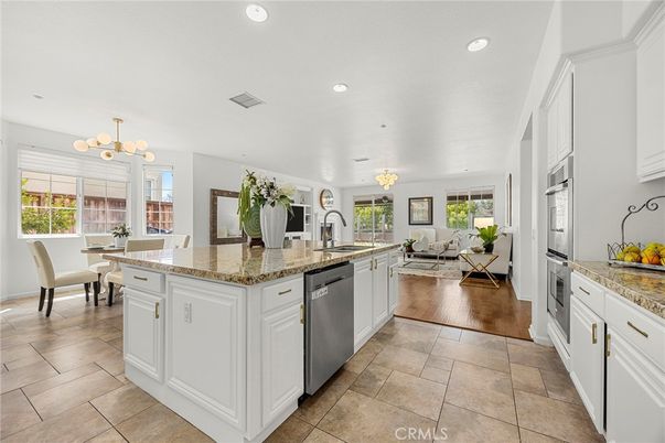 Chandelier, Dining room, Interior, Kitchen, Living room, Recessed Lighting, Stainless Steel Appliances, Wood Texture Flooring