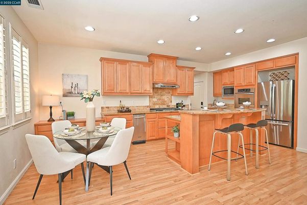 Dining room, Interior, Kitchen, Recessed Lighting, Stainless Steel Appliances, Wood Texture Flooring