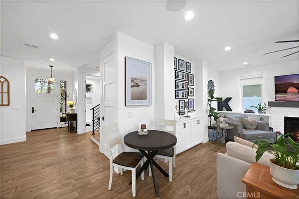 Dining room, Fireplace, Interior, Living room, Pendant Lights, Recessed Lighting, Wood Texture Flooring