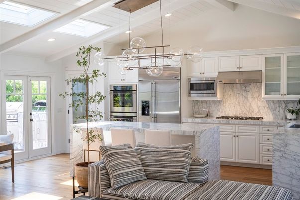 Interior, Kitchen, Marble Walls, Pendant Lights, Recessed Lighting, Stainless Steel Appliances, Wood Texture Flooring