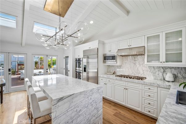 Interior, Kitchen, Marble Walls, Pendant Lights, Stainless Steel Appliances, Wood Texture Flooring