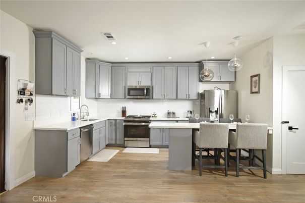 Interior, Kitchen, Pendant Lights, Recessed Lighting, Stainless Steel Appliances, Wood Texture Flooring