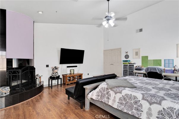 Bedroom, Fireplace, Interior, Recessed Lighting, Wood Texture Flooring