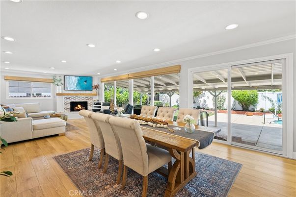 Dining room, Fireplace, Interior, Living room, Recessed Lighting, Wood Texture Flooring