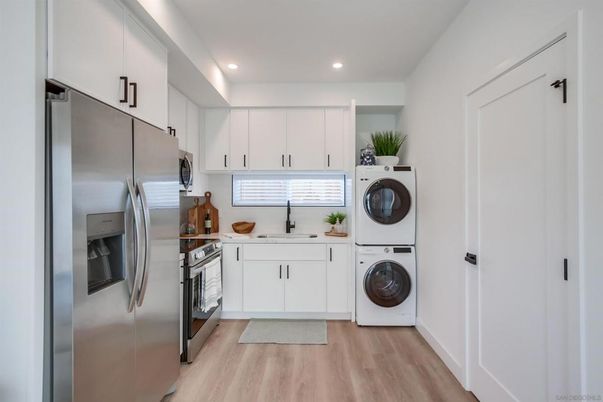 Interior, Kitchen, Recessed Lighting, Stainless Steel Appliances, Washer, Wood Texture Flooring