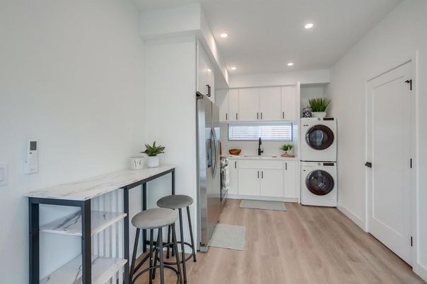 Interior, Kitchen, Recessed Lighting, Utility Closets, Washer, Wood Texture Flooring
