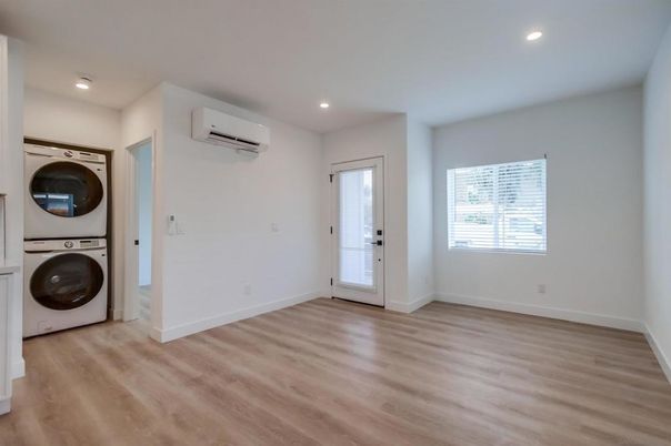 Empty room, Interior, Recessed Lighting, Utility Closets, Washer, Wood Texture Flooring
