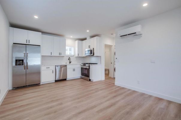 Interior, Kitchen, Recessed Lighting, Stainless Steel Appliances, Wood Texture Flooring