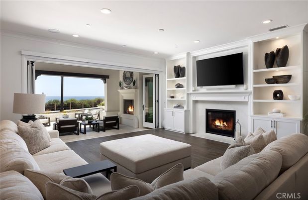 Fireplace, Interior, Living room, Recessed Lighting, Water, Wood Texture Flooring
