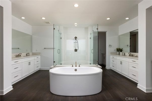 Bathroom, Dual Sink Vanities, Free Standing Baths, Glass Shower, Interior, Recessed Lighting, Wood Texture Flooring