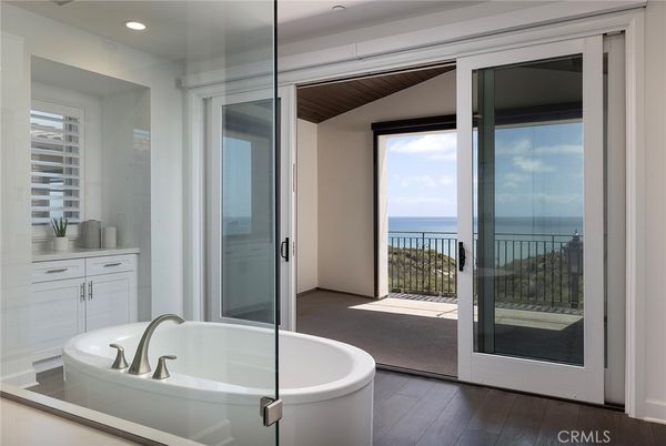 Bathroom, Free Standing Baths, Interior, Recessed Lighting, Water, Wood Texture Flooring