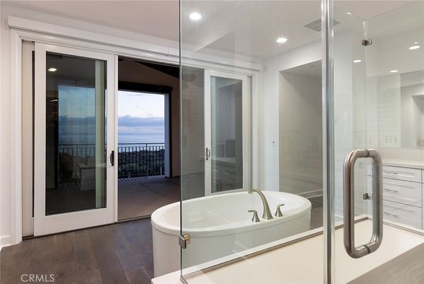 Bathroom, Glass Shower, Interior, Recessed Lighting, Water, Wood Texture Flooring