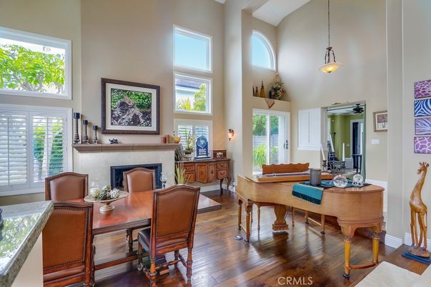 Dining room, Fireplace, Interior, Pendant Lights, Piano, Wood Texture Flooring