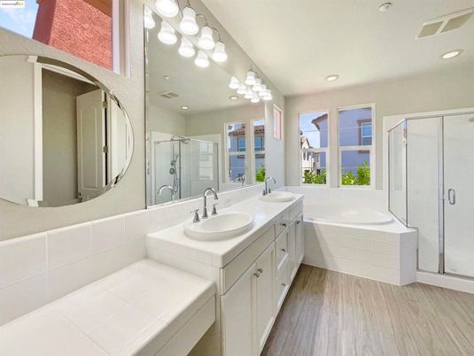 Bathroom, Dual Sink Vanities, Glass Shower, Interior, Recessed Lighting, Wood Texture Flooring
