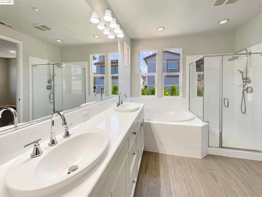 Bathroom, Dual Sink Vanities, Glass Shower, Interior, Recessed Lighting, Wood Texture Flooring