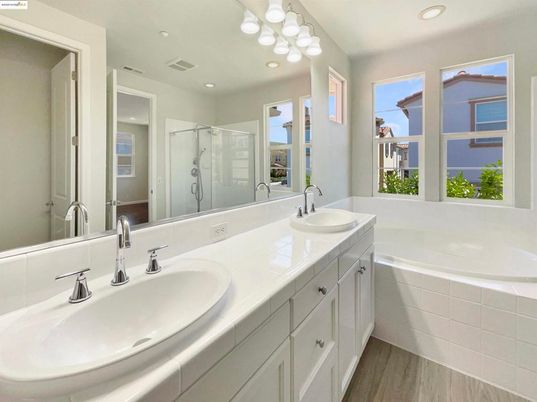 Bathroom, Dual Sink Vanities, Glass Shower, Interior, Recessed Lighting, Wood Texture Flooring