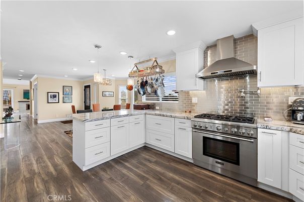Chandelier, Dining room, Interior, Kitchen, Pendant Lights, Recessed Lighting, Stainless Steel Appliances, Wood Texture Flooring