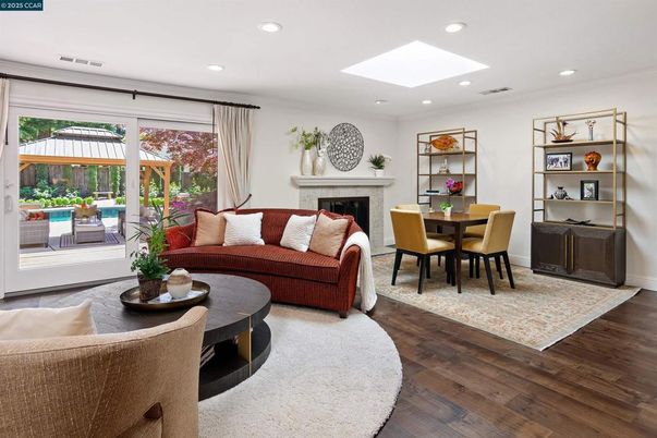 Dining room, Fireplace, Interior, Living room, Recessed Lighting, Wood Texture Flooring