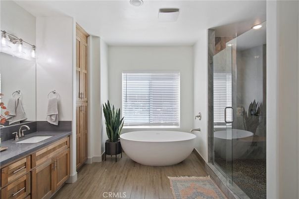 Bathroom, Dual Sink Vanities, Free Standing Baths, Glass Shower, Interior, Recessed Lighting, Wood Texture Flooring