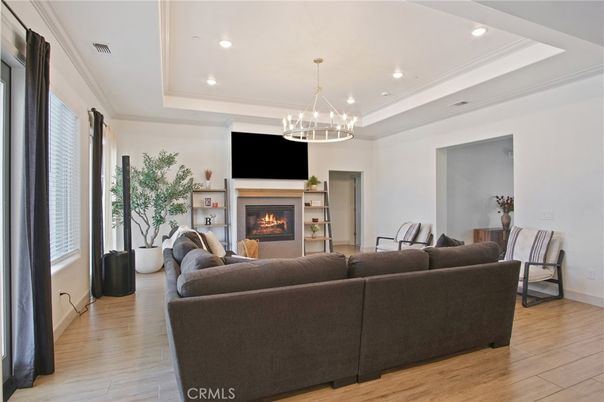 Chandelier, Fireplace, Interior, Living room, Pendant Lights, Recessed Lighting, Wood Texture Flooring