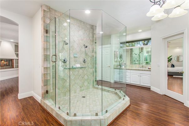 Bathroom, Bedroom, Fireplace, Glass Shower, Interior, Pendant Lights, Recessed Lighting, Wood Texture Flooring