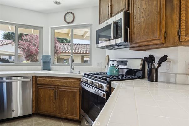 Interior, Kitchen, Recessed Lighting, Stainless Steel Appliances, Tile Countertops