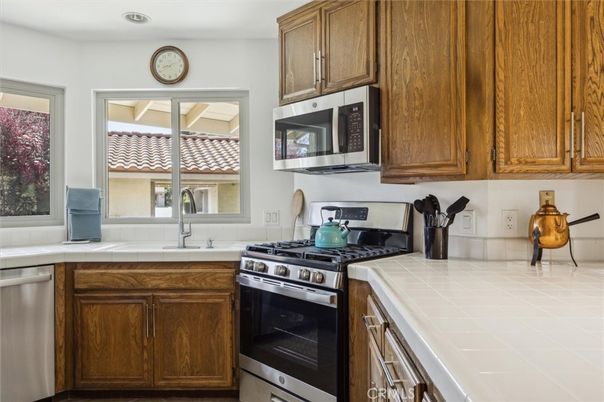 Interior, Kitchen, Recessed Lighting, Stainless Steel Appliances, Tile Countertops