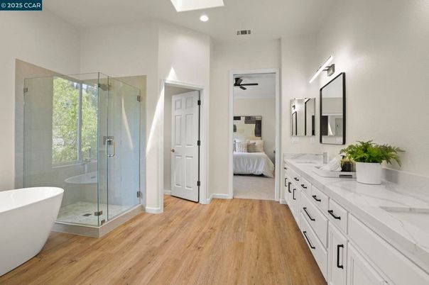 Bathroom, Bedroom, Dual Sink Vanities, Free Standing Baths, Glass Shower, Interior, Recessed Lighting, Wood Texture Flooring