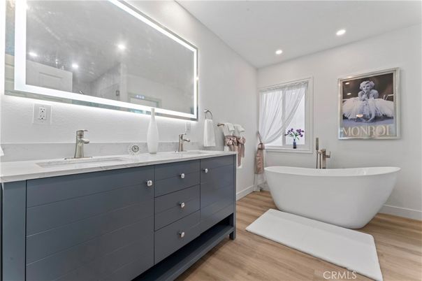 Bathroom, Dual Sink Vanities, Free Standing Baths, Interior, Recessed Lighting, Wood Texture Flooring
