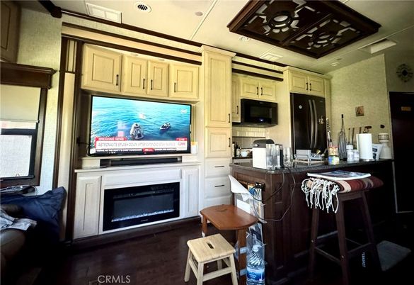 Fireplace, Interior, Kitchen, Recessed Lighting, Stainless Steel Appliances, Wood Texture Flooring