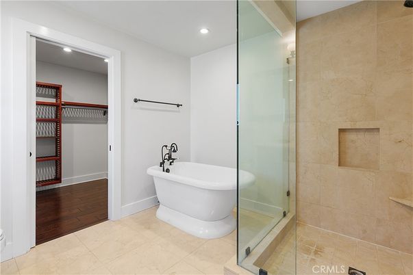 Bathroom, Free Standing Baths, Glass Shower, Interior, Recessed Lighting, Wood Texture Flooring