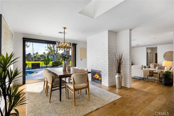 Chandelier, Dining room, Fireplace, Interior, Living room, Recessed Lighting, Stone Walls, Wood Texture Flooring