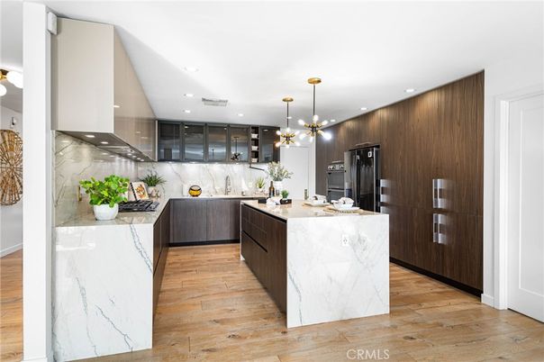 Interior, Kitchen, Marble Walls, Pendant Lights, Recessed Lighting, Stainless Steel Appliances, Wood Texture Flooring