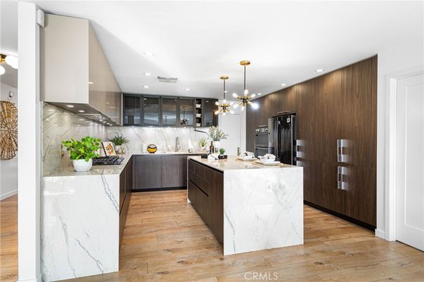 Interior, Kitchen, Marble Walls, Pendant Lights, Recessed Lighting, Stainless Steel Appliances, Wood Texture Flooring