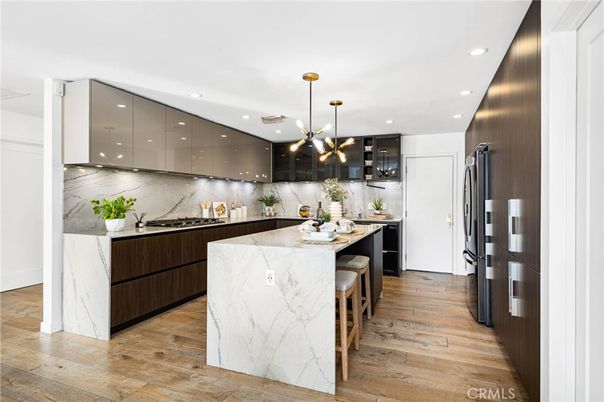 Interior, Kitchen, Marble Walls, Pendant Lights, Recessed Lighting, Stainless Steel Appliances, Wood Texture Flooring