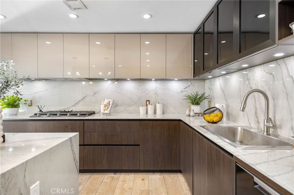 Interior, Kitchen, Marble Walls, Recessed Lighting, Stainless Steel Appliances, Wood Texture Flooring