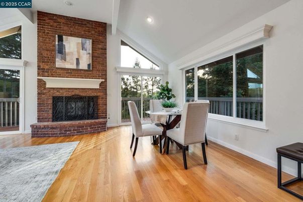 Dining room, Fireplace, Interior, Recessed Lighting, Stone Walls, Wood Texture Flooring