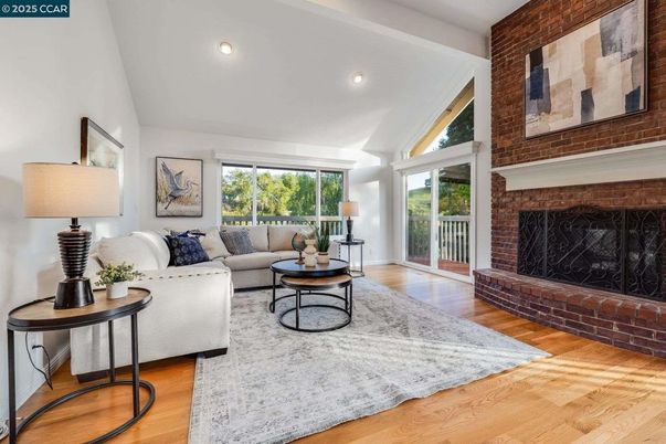 Fireplace, Interior, Living room, Recessed Lighting, Stone Walls, Wood Texture Flooring