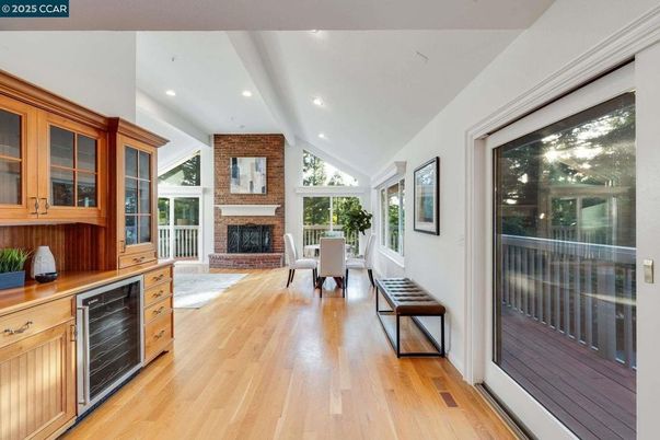 Dining room, Fireplace, Interior, Recessed Lighting, Stone Walls, Wood Texture Flooring