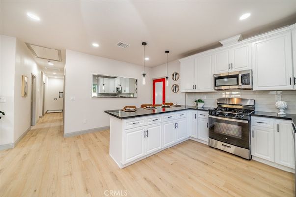 Interior, Kitchen, Pendant Lights, Recessed Lighting, Stainless Steel Appliances, Wood Texture Flooring